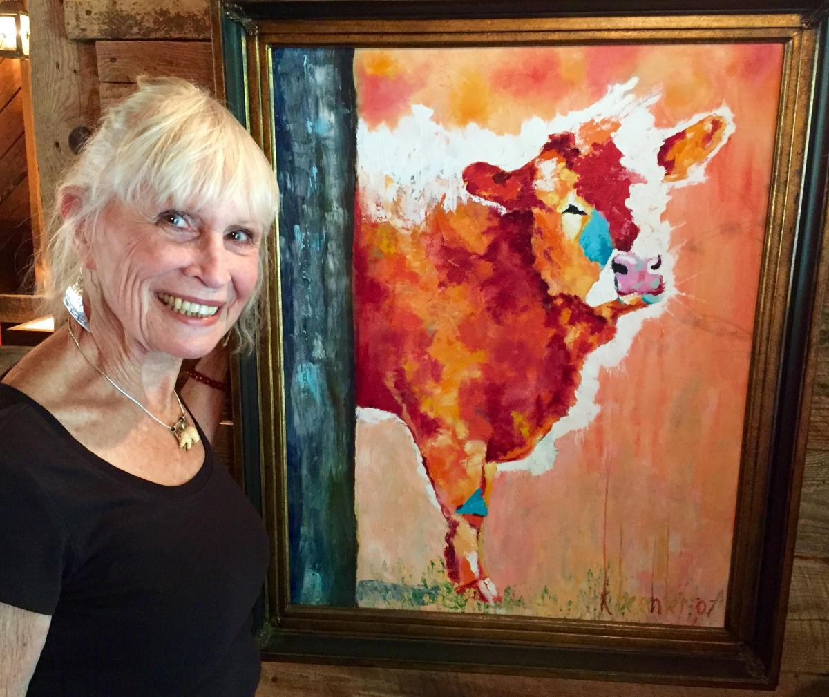 Photograph of artist Penny Bradley at her easel